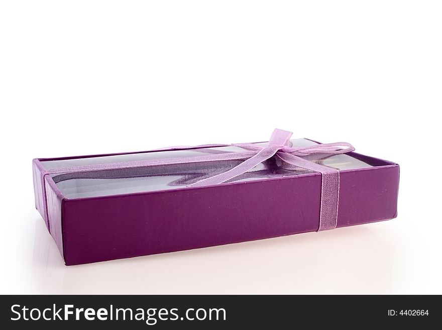 Small violet box with gift isolated on white. Small violet box with gift isolated on white