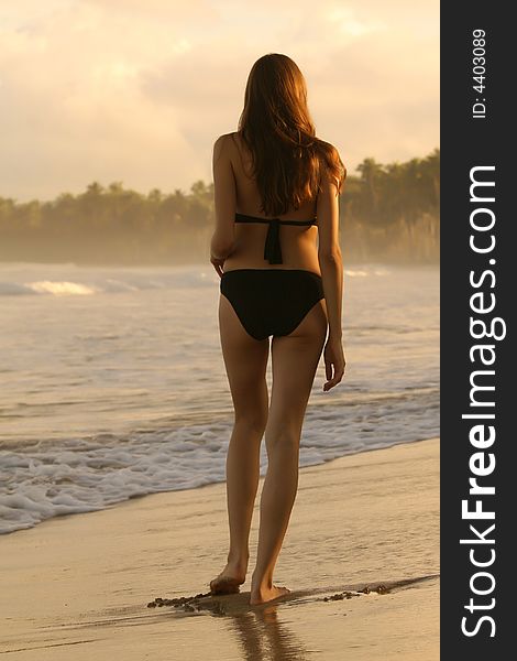 Woman walking on the beach in the caribbean. Woman walking on the beach in the caribbean