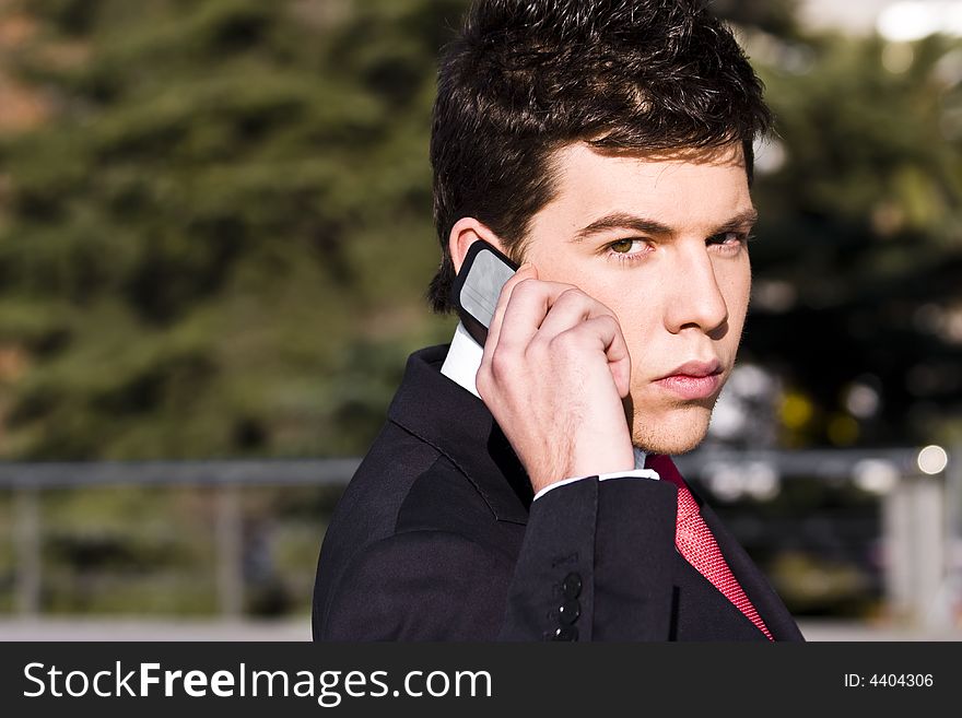 Businessman looking information at his phone. Businessman looking information at his phone