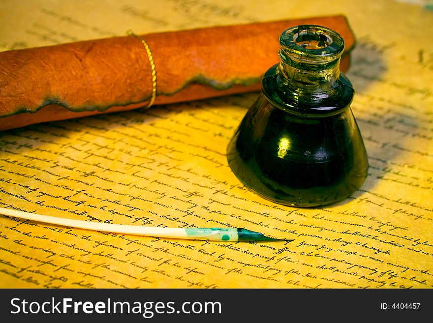 Feather , inkwell and paper with an antique look