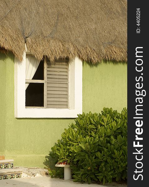 Thatch roof beach hut with window