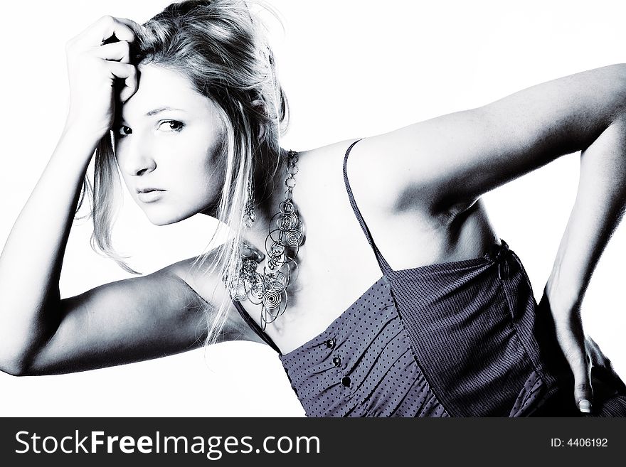 Young girl in a dress in the studio on a white background. Young girl in a dress in the studio on a white background.