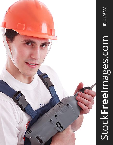 Muscular young man in a builder uniform with tools. Muscular young man in a builder uniform with tools.