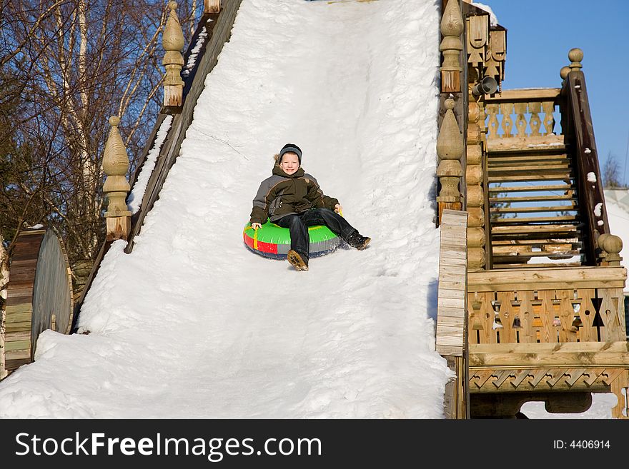 Winter children's entertainments on driving from a hill. Winter children's entertainments on driving from a hill