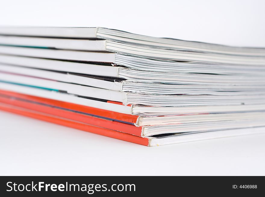 Pile of magazines on a white background