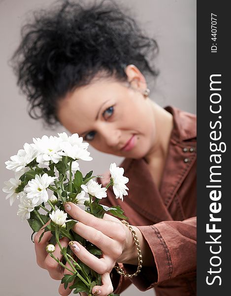 An image of a  beautiful woman with white flowers. An image of a  beautiful woman with white flowers