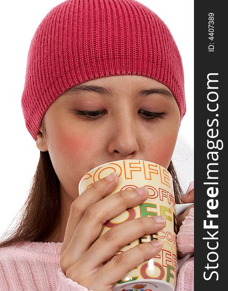 Female girl on her winter clothes sipping a hot coffee. Female girl on her winter clothes sipping a hot coffee