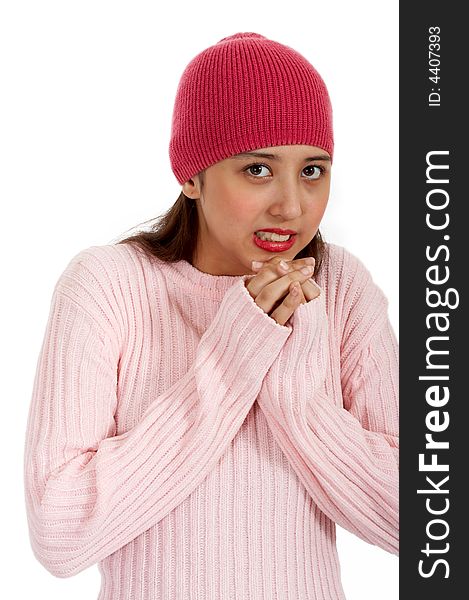 Freezing teenager in winter clothes -trying to warm her hands