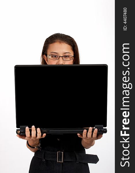 Attractive office girl carrying a black laptop