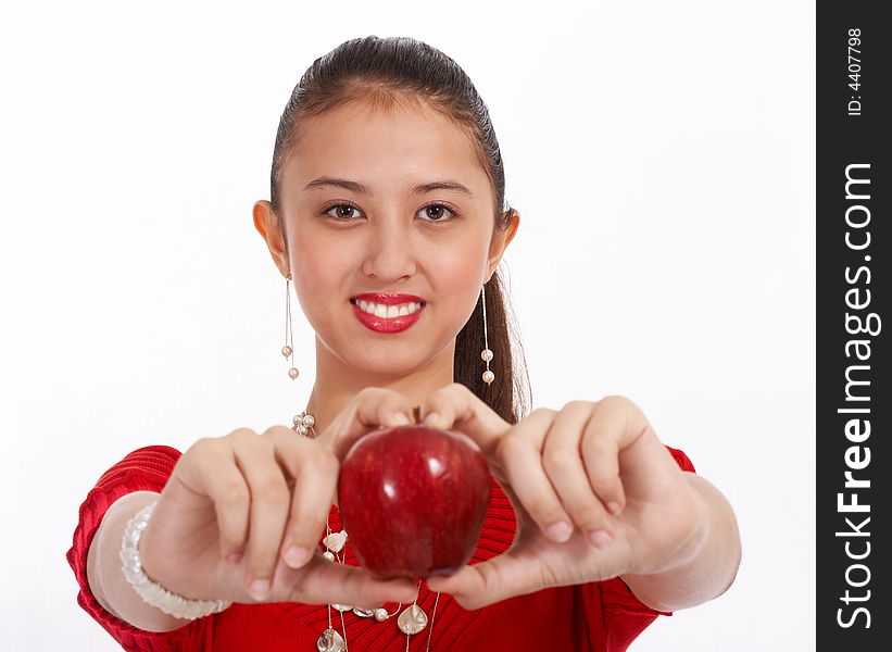 Attractive young woman holding red delicious apple. Attractive young woman holding red delicious apple