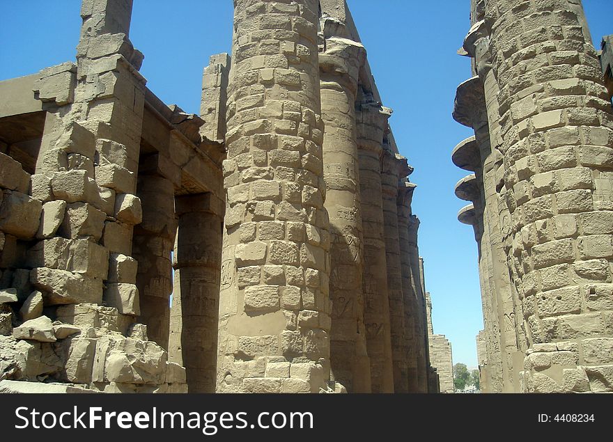 View on ruins of ancient pillars in Karnak temple. View on ruins of ancient pillars in Karnak temple