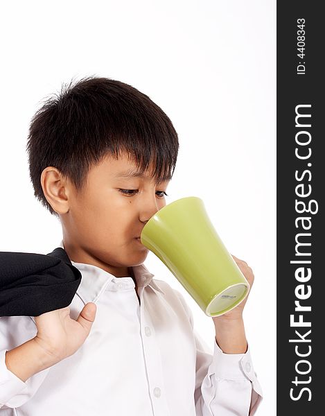 Young office boy is drinking on a white background