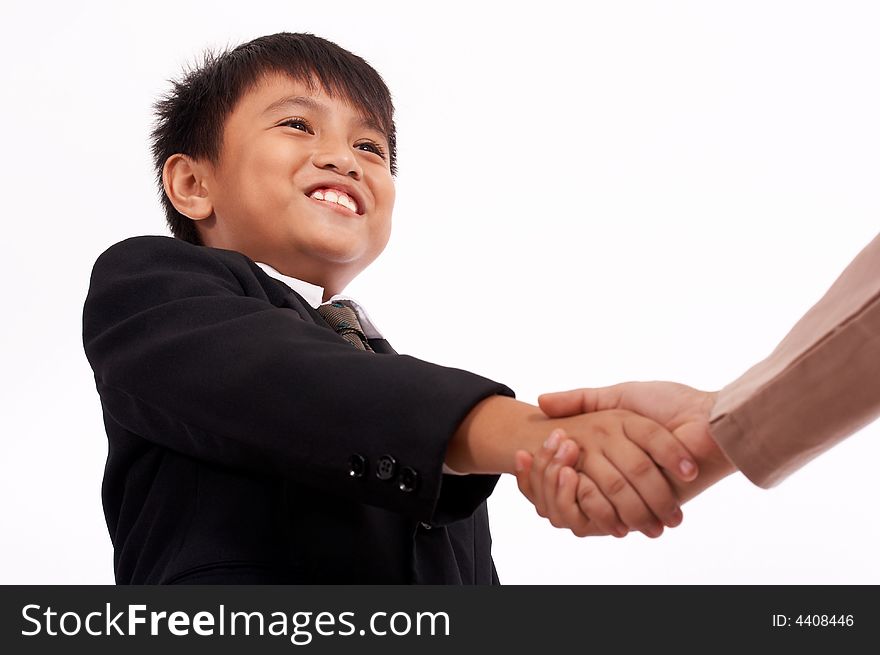 Smiling young boss shaking hands with the business partner