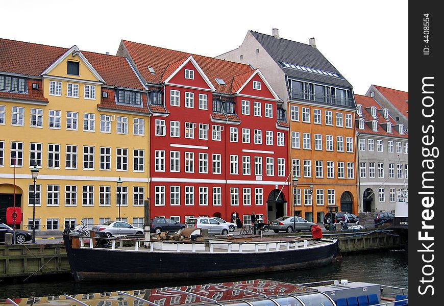 Copenhagen - houses and boats in the water front of the canals. Copenhagen - houses and boats in the water front of the canals