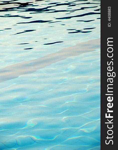 An image of the surface of the water of a swimming pool. An image of the surface of the water of a swimming pool