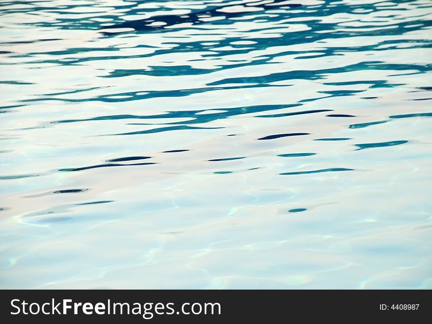 An image of the surface of the water of a swimming pool. An image of the surface of the water of a swimming pool