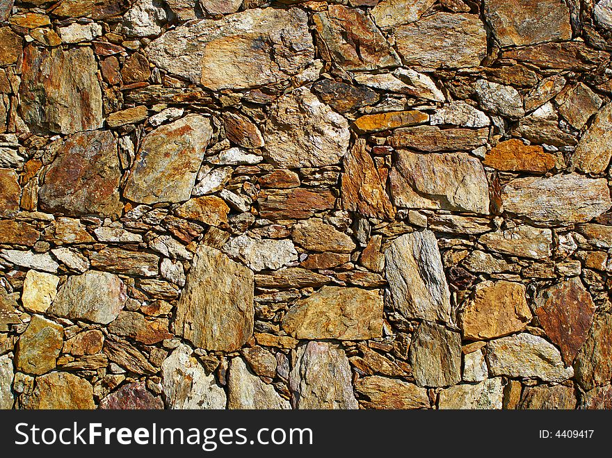 Detail from a stone wall - background