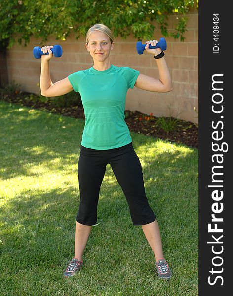 Backyard exercise with small weights. Backyard exercise with small weights