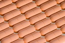 Rows Of Pink Pills Over White Stock Photos