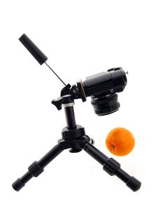 Photographing Of Orange. Black Tripod And Camera Royalty Free Stock Photo Photographing Of Orange. Black Tripod And Camera Royalty Free Stock Photo