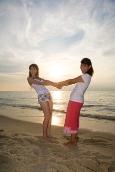 Two Girls Having Fun At The Beach Royalty Free Stock Photography Two Girls Having Fun At The Beach Royalty Free Stock Photography