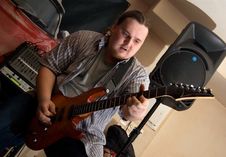 The Musician With A Guitar Stock Image