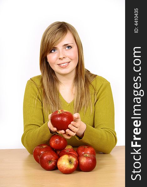 Beautiful young woman holding a apple