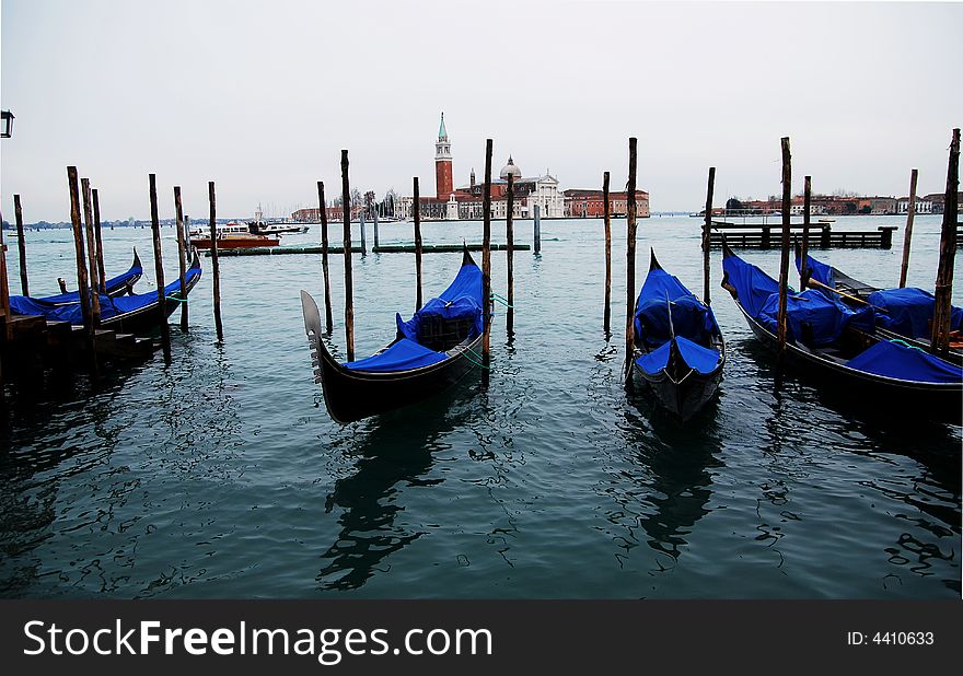 Gondola over Venice canal with blue water