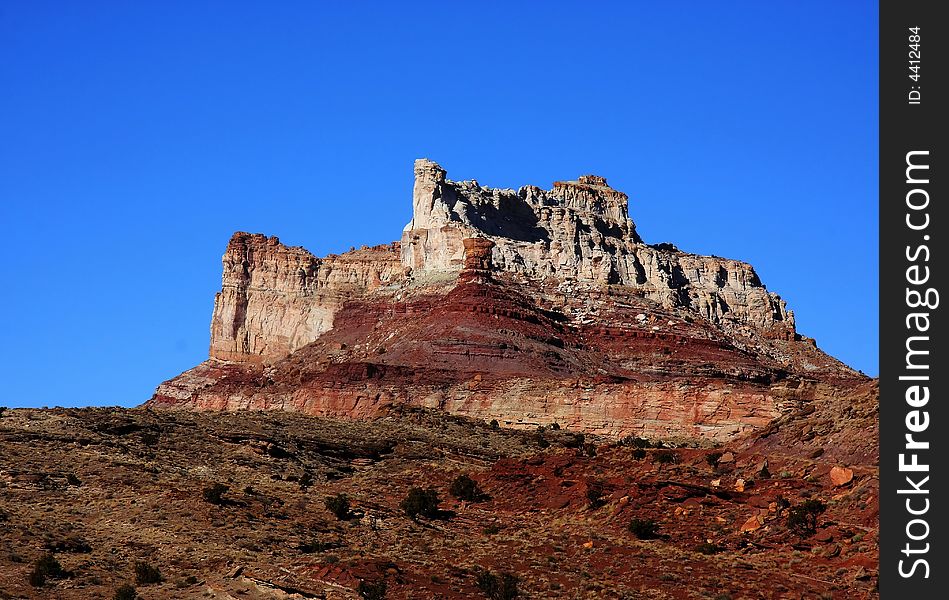 View of the red rock formations in Capitol Reef National Park with blue sky�s and clouds. View of the red rock formations in Capitol Reef National Park with blue sky�s and clouds