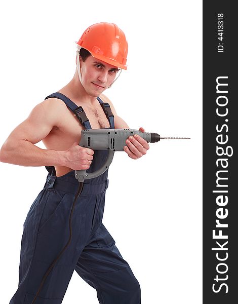 Muscular young man in a builder uniform with tools. Muscular young man in a builder uniform with tools.