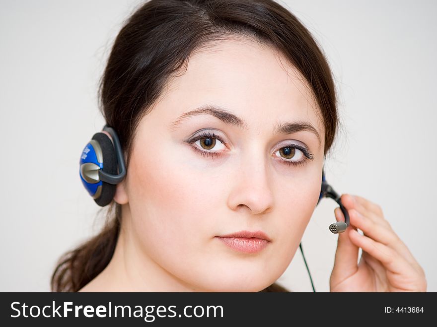 A friendly / secretary / telephone operator with headphone