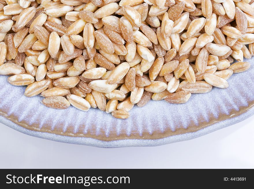 A dish of wheat berries ready to include in a nutritious recipe.