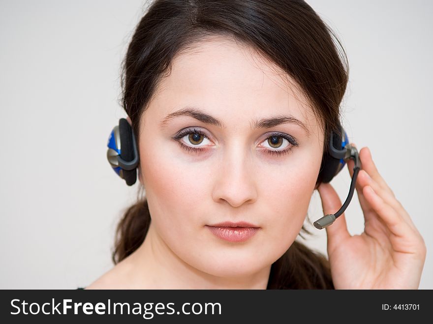 A friendly / secretary / telephone operator with headphone