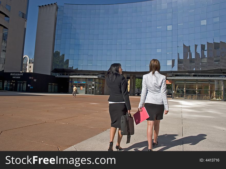 Two young Businesswomen going downtown. Two young Businesswomen going downtown