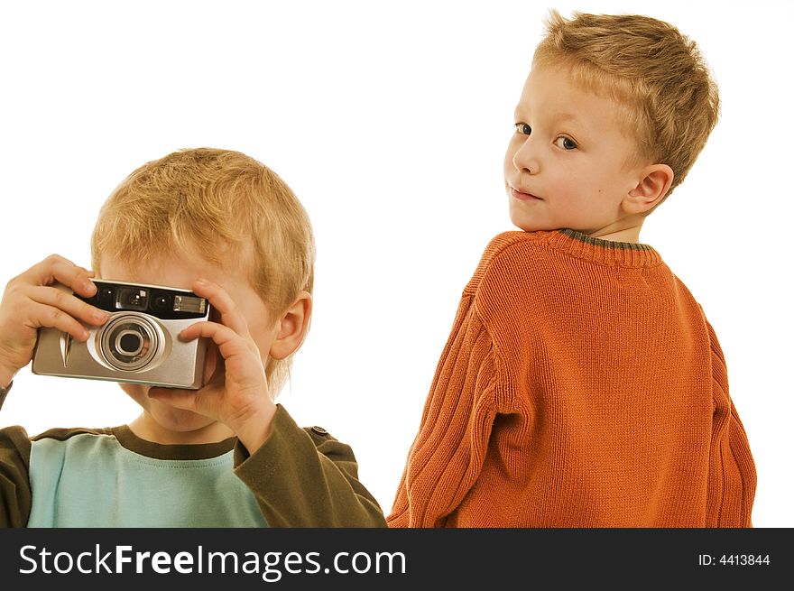 Two little boys playing with a camera. Two little boys playing with a camera.