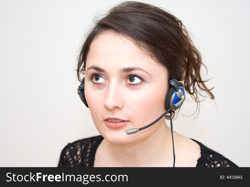 A friendly / secretary / telephone operator with headphone