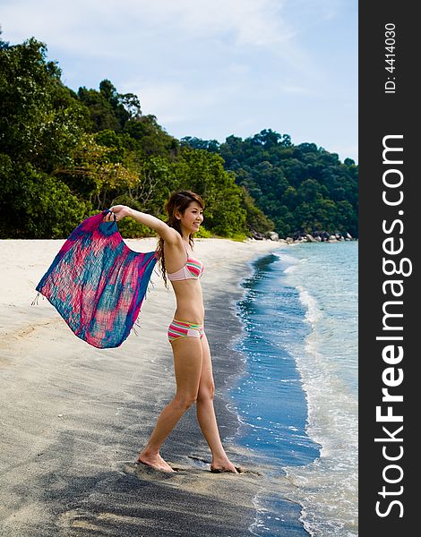 Young woman having fun at the beach