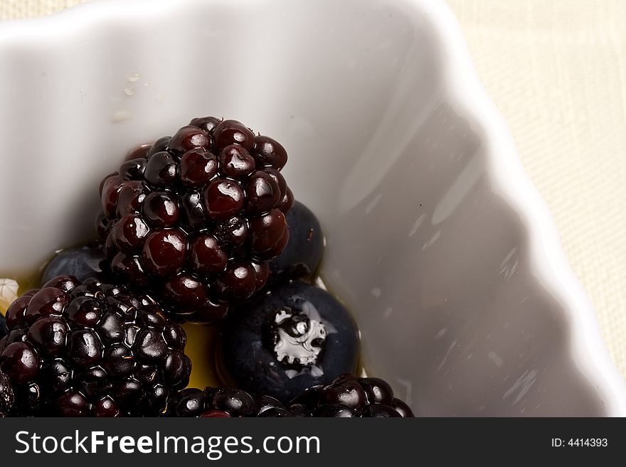 Healthy white bowl of ripe fruit in syrup. Healthy white bowl of ripe fruit in syrup