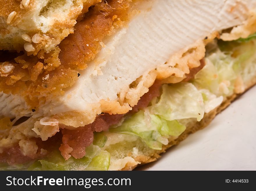 Buffalo bbq chicken sandwich on a white plate