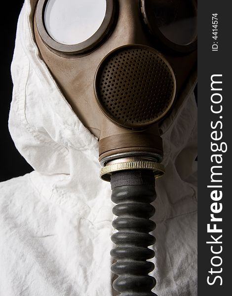 Person in gas mask on dark background