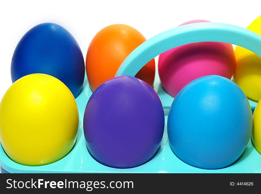 Easter holiday. Color eggs in a tray on white  background. Easter holiday. Color eggs in a tray on white  background.