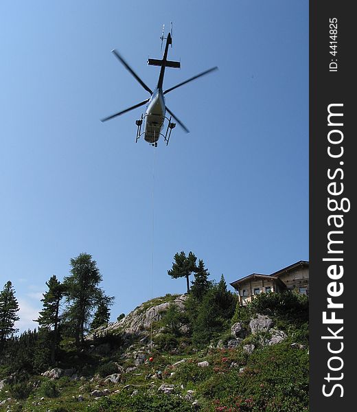 Helicopter work in the mountains. Helicopter work in the mountains