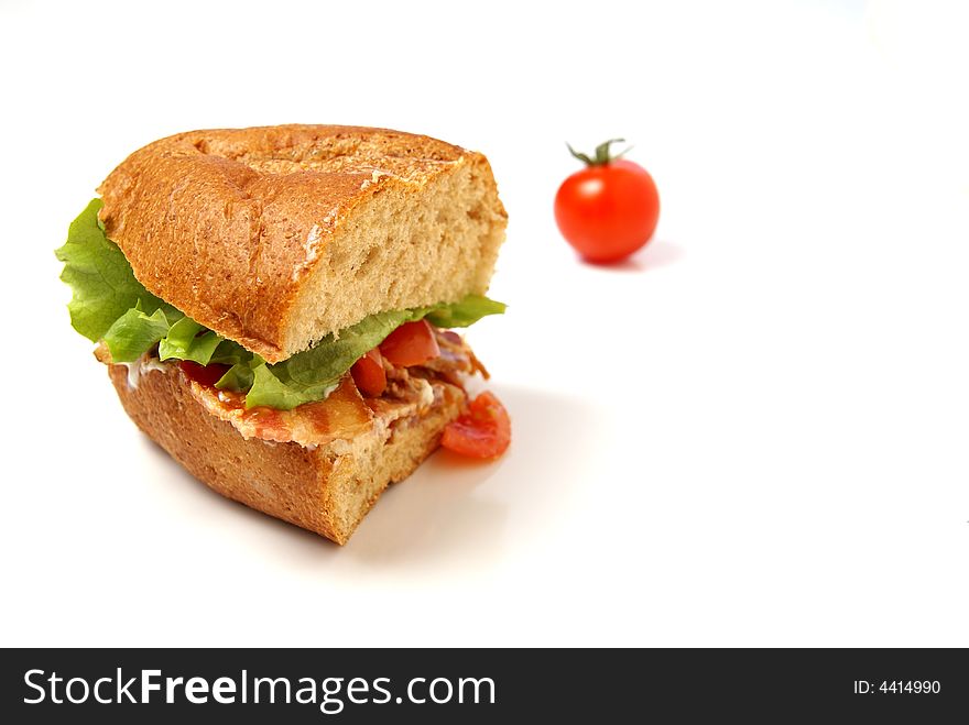 Bacon Sandwich with bacon, lettuce, tomato and mayo on whole wheat coarse bread bun