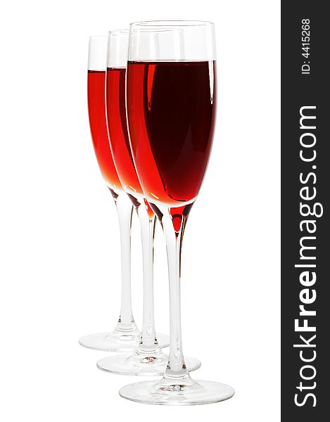 Three glasses with red wine on a white background