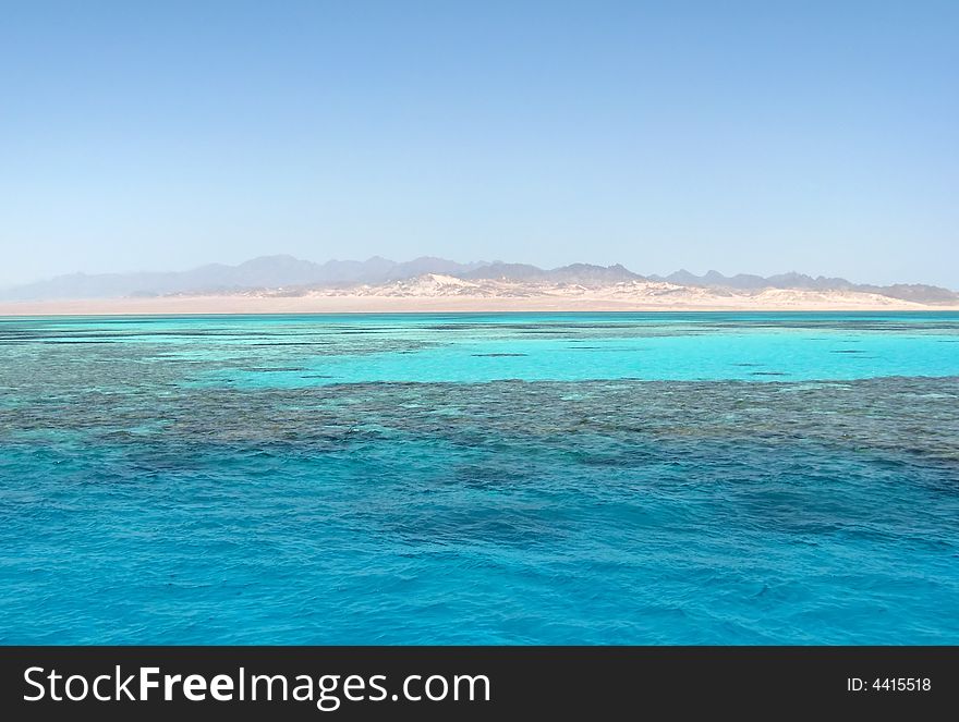 Hilly sea-coast and aeruginous see