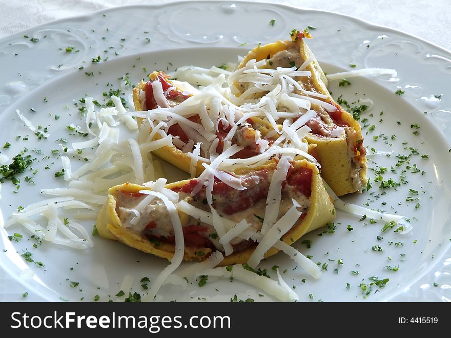 Italian dish with pasta, fish and tomato