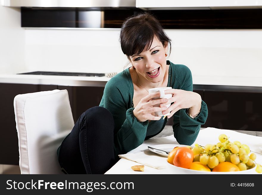 Home life: woman drinking a cup of tea