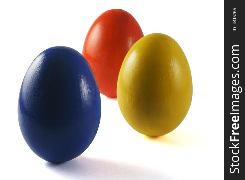 Three coloured eggs isolated on white. Three coloured eggs isolated on white
