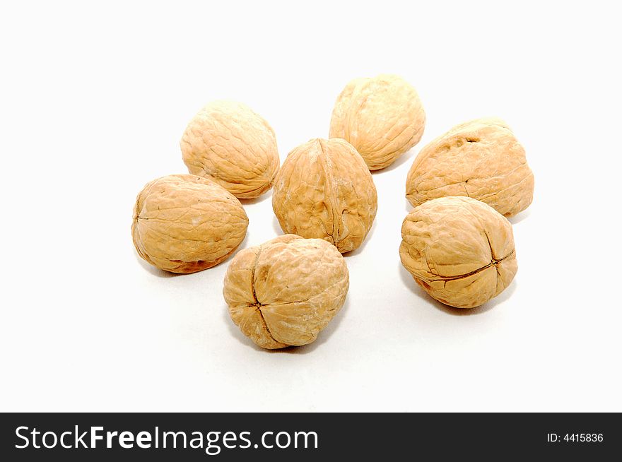 Very delicious walnuts in the shell on white background. Very delicious walnuts in the shell on white background.