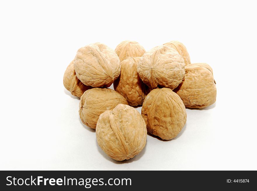 Very delicious walnuts in the shell on white background. Very delicious walnuts in the shell on white background.